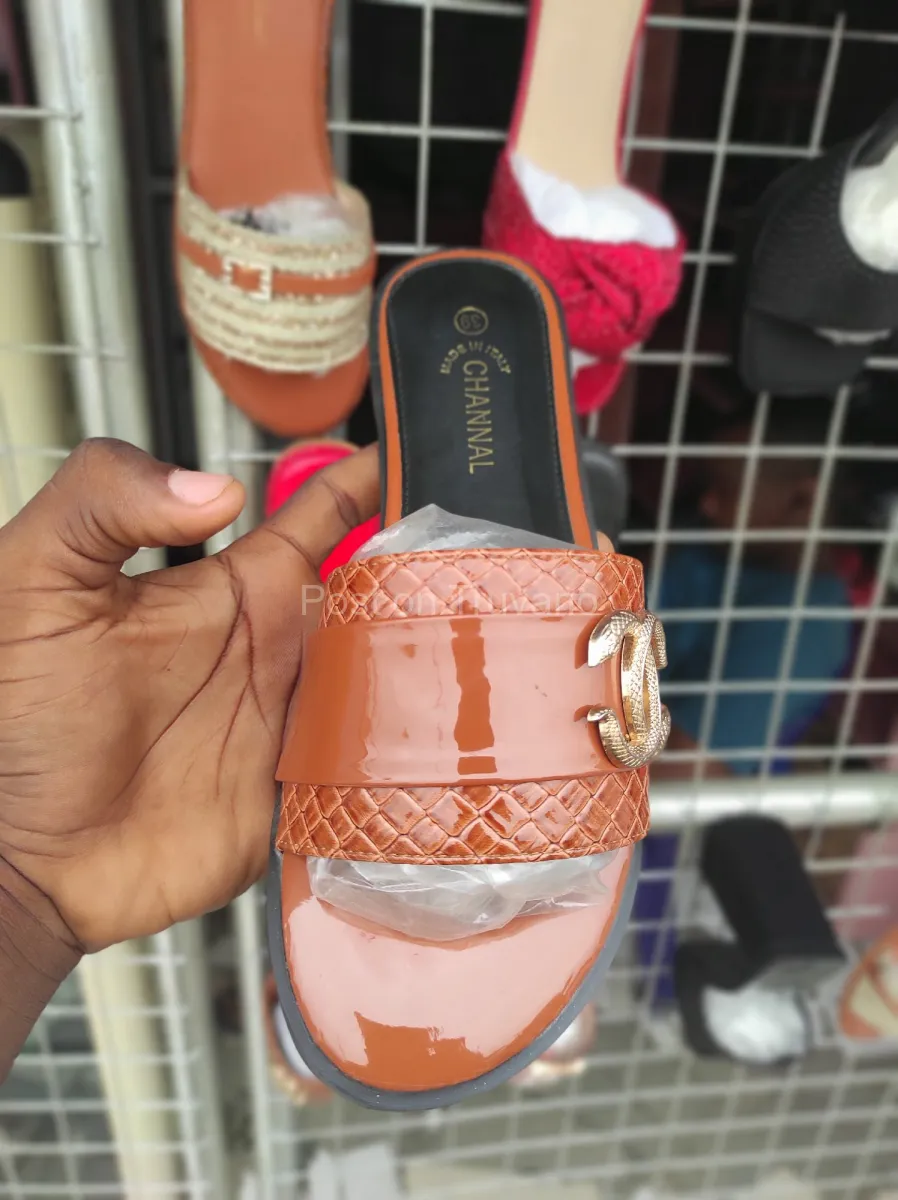 brown patent leather-style flat slip-on sandals