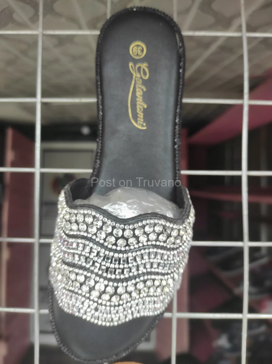 Black slip-on flat sandals